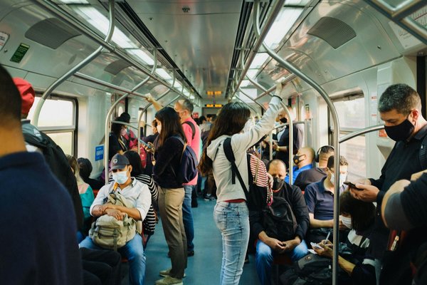How can inclusive design principles be applied to enhance public transportation accessibility?